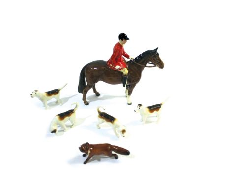 BESWICK HUNTING SET including a Beswick Huntsman on a Brown Horse, Model No 1501 and issued from 1957-1995. Also with 4 Beswi