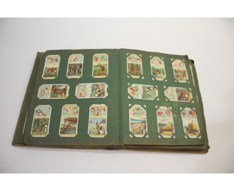 CIGARETTE CARD ALBUMS & SCRAP BOOKS 3 cigarette card albums including Turf Regalia Series, Turf Famous Escapes, Carreras Happ