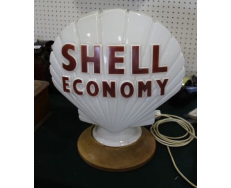 SHELL PETROL GLOBE a glass Shell Economy double sided petrol globe, mounted on a turned oak wooden stand. Marked inside, Prop