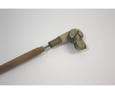 DOG HEAD SWORDSTICK with a resin handle in the form of a Dog, with a metal blade, bamboo shaft and brass collar and ferule. 8