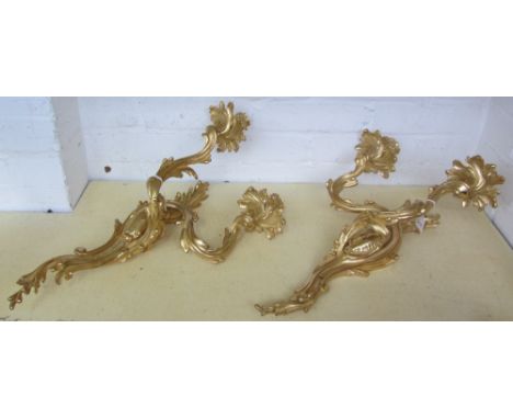 A pair of gilt bronze twin light wall appliques of Louis XV style,  20th century, each with rococo scrolled branches and back