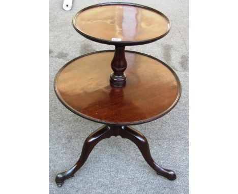 A George III mahogany circular two tier dumb waiter on tripod base, 60cm wide. 