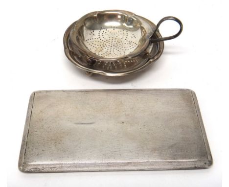 A silver rectangular slide action cigarette case, the exterior with engine turned decoration, Birmingham 1954, gross weight 2