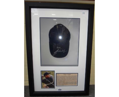 Sporting memorabilia; Tiger Woods, a signed cap, mounted, framed and glazed, with certificate of authenticity to rear from 'L
