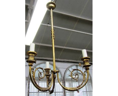 A pair of gilt metal three light chandeliers of Louis XVI style circa 1940, each with downswept scroll arms, fitted for elect