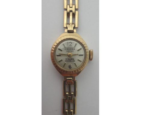 A ladies 9ct gold Oriosa bracelet wristwatch, the signed circular silvered dial with Arabic and baton shaped numerals, the 9c