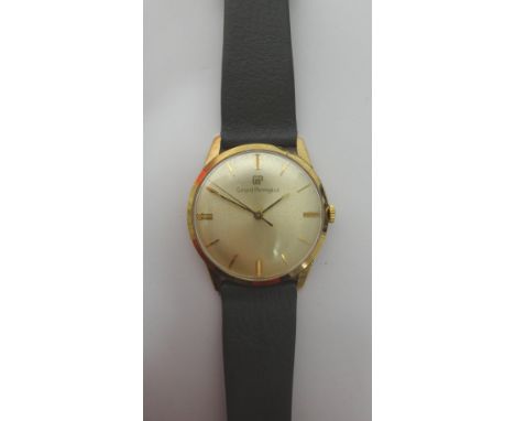 A gentleman's gold circular cased Girard-Perregaux wristwatch, the signed circular silvered dial with gilt baton shaped numer