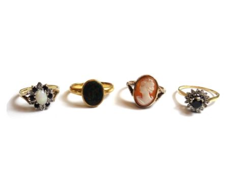 A gold and bloodstone set oval signet ring, detailed 18 CT, a gold, sapphire and diamond set circular cluster ring, a gold ri