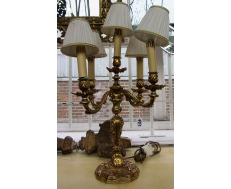 A Victorian style gilt metal five branch table lamp, modern, the central foliate cast stem issuing four scroll branches on a 