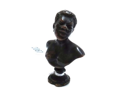 A miniature bronze bust, early 19th century, modelled and cast as an African male on socle, 5.8cm high.