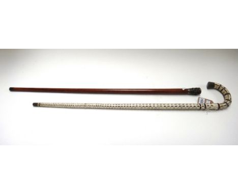 A shark vertebrae walking stick, early 20th century, with carved horn embellishments, 90.5cm, and an Indian walking cane with