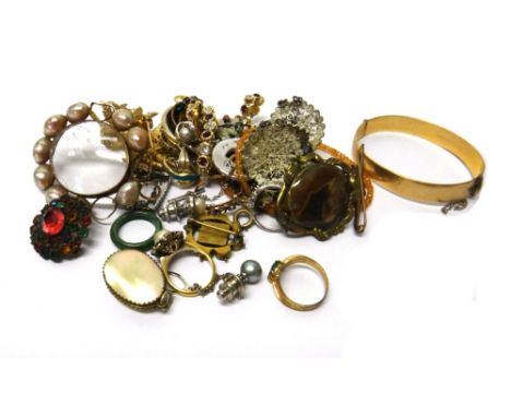 A group of mostly costume jewellery, including; a gilt oval hinged bangle, a pair of cufflinks, two pendants with chains, a n