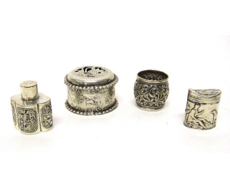 An oval hinge lidded Dutch cachou box, decorated with a huntsman with a dog, a circular pot pouri box, with a pierced cover, 