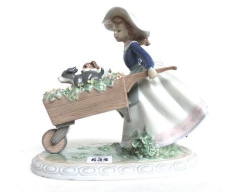 A Lladro figure modelled as a young girl pushing a wheelbarrow full of flowers (20.5cm high), five other Lladro figure groups