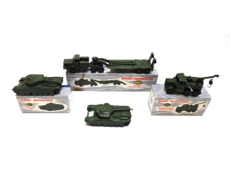 Three Dinky military vehicles; a 660 tank transporter, a 651 centurian tank and a 661 recovery tractor, all boxed, and a 651 