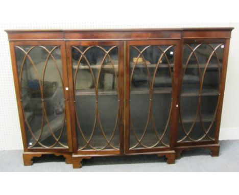 A made up early 19th century low mahogany breakfront three section bookcase on bracket feet, 184cm wide.