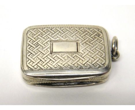 A George III silver rectangular vinaigrette, gilt within, with a plain pierced grill, the cover with engine turned decoration