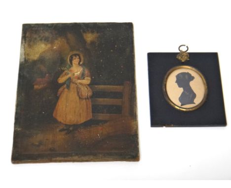 An oval silhouette portrait of a lady, displayed in a black papier mache rectangular frame and a naive portrait of the standi