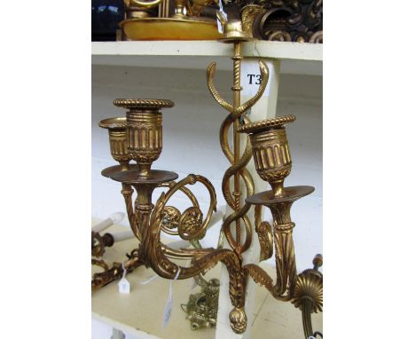 A set of four modern gilt bronze three branch wall appliques, each with Achilles winged crest over a serpent entwined body is