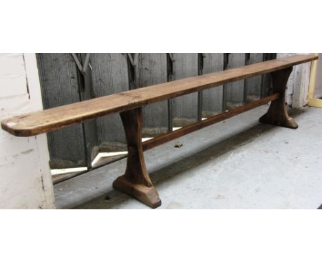 A 19th cnetury oak rectangular bench with pair of trestle supports, 265cm wide. 
