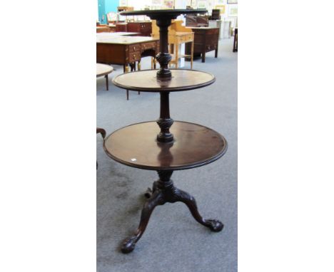 A George III and later three tier mahogany dumb waiter with three circular dished graduated tiers on central column, tripod b