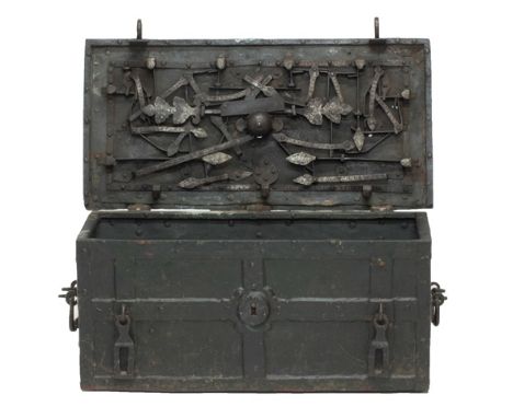 A 17th century iron bound Armada trunk, the lid underside with visible elaborate lock mechanism and integral candle box, with