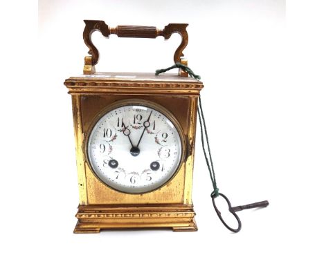 A French gilt brass cased carriage clock with foliate painted enamel dial and plinth base and a two train movement, 15cm high