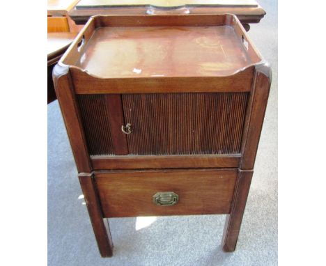 A George III mahogany bedside commode, with tambour cupboard door above pull-out drawer, 51cm wide. 