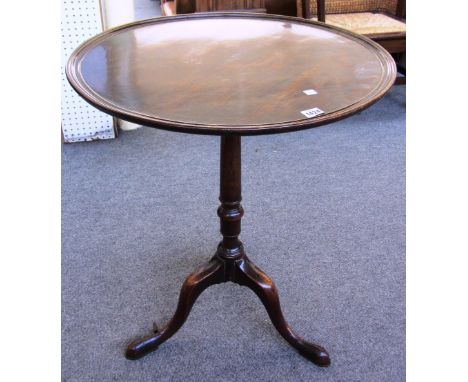 A George III mahogany tripod table, the circular dished top on cabriole leg tripod base, 61cm diameter. 