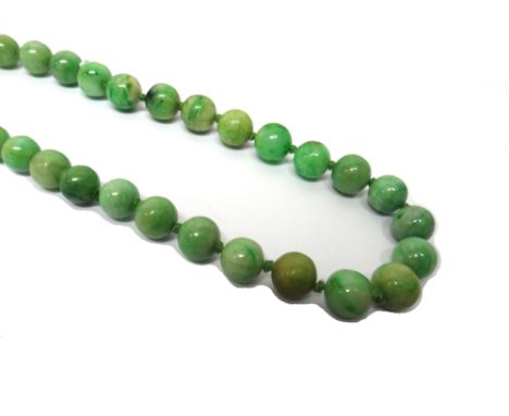 A single row necklace of spherical jade beads, graduating in size to the front, on a rectangular snap clasp, detailed SILVER.