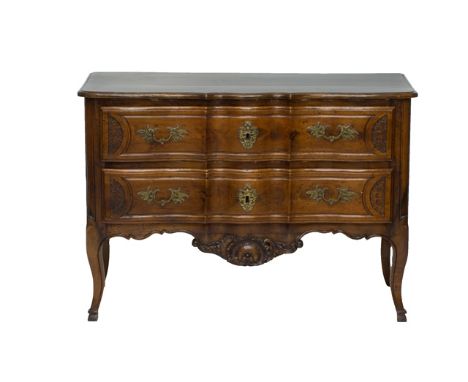 A 18th century French carved fruitwood serpentine two drawer commode on cabriole supports, 130cm wide. 