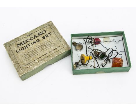 Meccano M280 Lighting Set, comprising two headlights , one with clear, other with green glass, loose red and clear lens, yell