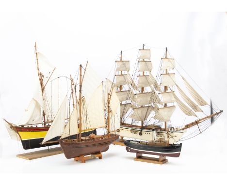 Three static Model Yachts and Sailing Boats and one Tug, Three masted Schooner, white hull with black and blue bands, varnish
