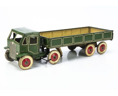 A Large Mettoy Tinplate Clockwork Eight Wheel Articulated Lorry, dark green body with cream lining, 'Dunlop Fort' tyres with 