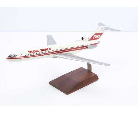 Model of a TWA Boeing 727, a painted wooden model of a 727 in TWA livery on metal and polished wood stand, made in the Philip
