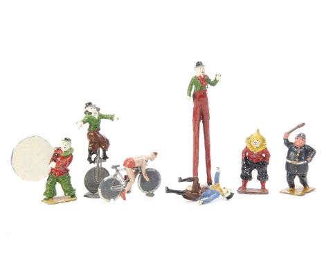 Charbens lead Circus figures in good condition comprising clown with hoop, unicyclist, standing clown, clown policeman clown 