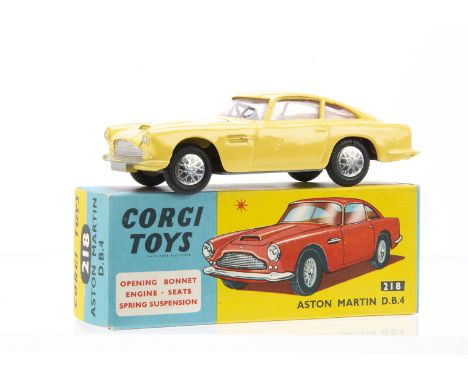 A Corgi Toys 218 Aston Martin DB4, primrose yellow body, red interior, flat spun hubs with wheel labels, in original box with