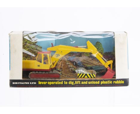 Britains 1970s version boxed set 9580 JCB Excavator Bagger,  model VG but usual deterioration of rubber tracks on plastic sup