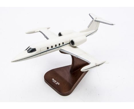 Model of A 35A Gates Lear Jet,   a painted wooden model of a Gates 35A Lear jet 1:48 scale on polished wood stand, made in th