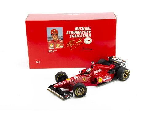 A Paul's Model Art (Minichamps) 1:12 Michael Schumacher Collection Ferrari F 310/2, 1996 Italy GP, #510 961221, in original b