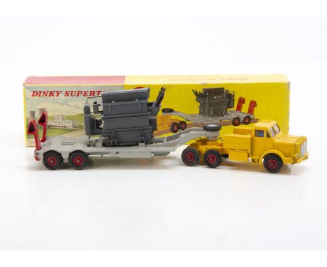 A Dinky Supertoys 908 Mighty Antar With Transformer, yellow tractor unit, light grey detachable trailer, red ramps and hubs, 