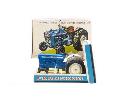 Britains boxed 9527 Ford 5000 Tractor in uncommon later short version box with plinth,  tractor VG, deterioration to rear hub