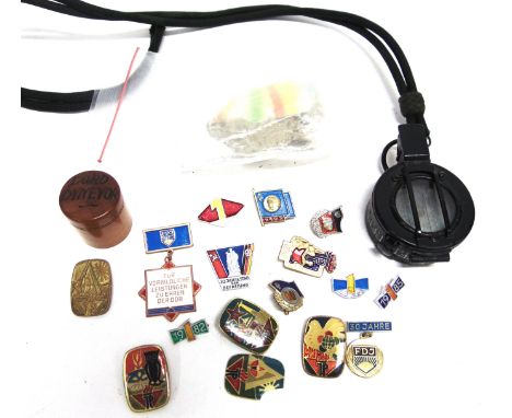 ASSORTED COLLECTABLES  comprising a British Mk III prismatic compass, 1940; a fragment of the Berlin Wall; fifteen East Germa