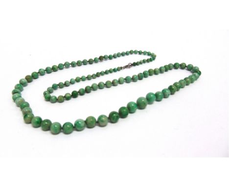 A GRADUATED ROW OF JADE BEADS  the one hundred and three beads of approximately 4.5/10mm diameter, 78cm long to a bolt ring c