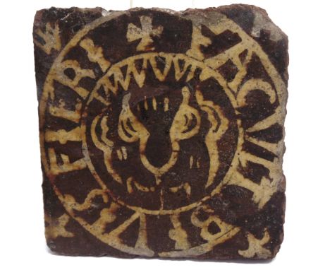 AN ENCAUSTIC TILE  12cm square  A typed label attached verso reads: 'This tile is early 18th century, so say experts at the A