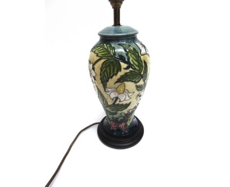 A MOORCROFT 'FRUIT GARDEN' PATTERN TABLE LAMP  with shade, the lamp 38cm high including electrical fitting