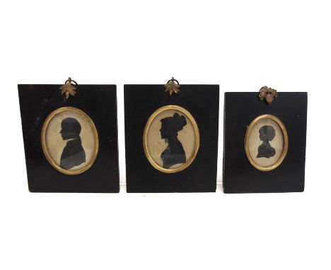 THREE SILHOUETTE PORTRAIT MINIATURES  comprising a gentleman, lady and girl, the latter identified verso as Charlotte Eliza B