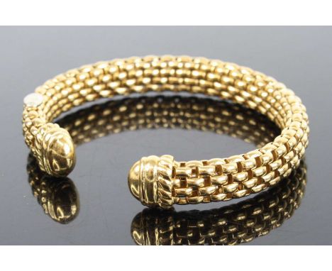 A Fope 18ct yellow gold meshlink torque bangle, having polished terminals, bangle w.9mm, dia. 55 x 50mm, gross weight 33.3g, 