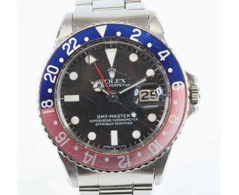 A gents Rolex Oyster Perpetual GMT Master stainless steel automatic wristwatch, having black dial with luminous hour markers 