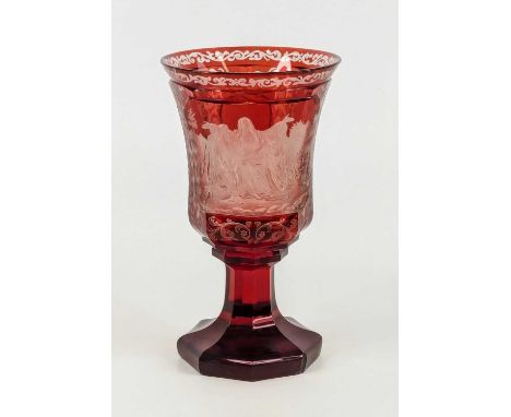 A Bohemian flashed ruby glass goblet, 19th century, etched with Moses with arms raised by Aaron and Hur upon Mount Horeb, the